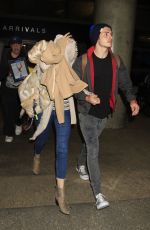 BELLA THORNE and Gregg Sulkin at Los Angeles Internatipnal Airport 06/03/2016