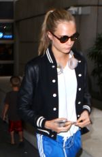 CARA DELEVINGNE at Los Angeles International Airport 06/04//2016