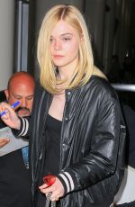 ELLE FANNING at LAX Airport in Los Angeles 06/23/2016