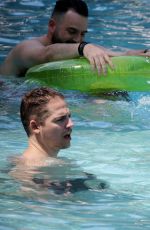 HAILEY BALDWIN in Swimsuit at a Pool in Miami 06/12/2016