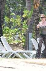 LINDSAY LOHAN and Egor Tarabasov on Romantic Beach Stroll in Port Louis 06/14/2016