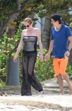 LINDSAY LOHAN and Egor Tarabasov on Romantic Beach Stroll in Port Louis 06/14/2016