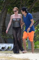 LINDSAY LOHAN and Egor Tarabasov on Romantic Beach Stroll in Port Louis 06/14/2016