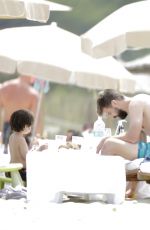 SHAKIRA in Bikini Top at a Beach in Ibiza 05/25/2016
