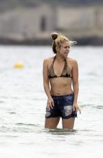 SHAKIRA in Bikini Top at a Beach in Ibiza 05/25/2016