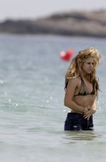 SHAKIRA in Bikini Top at a Beach in Ibiza 05/25/2016