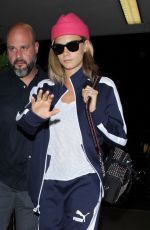 CARA DELEVINGNE Arrives at LAX Airport in Los Angeles 07/27/2016