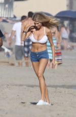 CHARLOTTE MCKINNEY in Bikini Top at a Beach Party in Malibu 07/02/2016