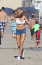 CHARLOTTE MCKINNEY in Bikini Top at a Beach Party in Malibu 07/02/2016