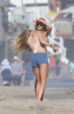 CHARLOTTE MCKINNEY in Bikini Top at a Beach Party in Malibu 07/02/2016