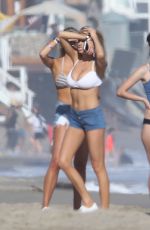 CHARLOTTE MCKINNEY in Bikini Top at a Beach Party in Malibu 07/02/2016