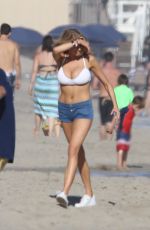 CHARLOTTE MCKINNEY in Bikini Top at a Beach Party in Malibu 07/02/2016