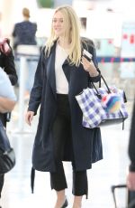 DAKOTA FANNING at Pearson International Airport in Toronto 07/11/2016
