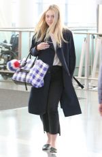 DAKOTA FANNING at Pearson International Airport in Toronto 07/11/2016