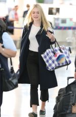 DAKOTA FANNING at Pearson International Airport in Toronto 07/11/2016