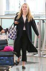 DAKOTA FANNING at Pearson International Airport in Toronto 07/11/2016