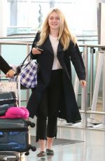 DAKOTA FANNING at Pearson International Airport in Toronto 07/11/2016