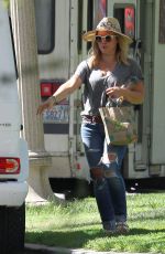 HILARY DUFF in Ripped Jeans at a Park in New York 07/25/2016
