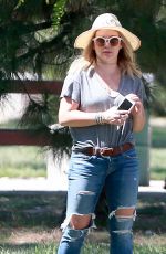 HILARY DUFF in Ripped Jeans at a Park in New York 07/25/2016