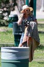 HILARY DUFF in Ripped Jeans at a Park in New York 07/25/2016