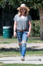 HILARY DUFF in Ripped Jeans at a Park in New York 07/25/2016