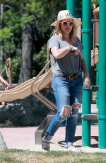 HILARY DUFF in Ripped Jeans at a Park in New York 07/25/2016