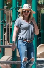 HILARY DUFF in Ripped Jeans at a Park in New York 07/25/2016