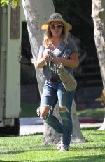 HILARY DUFF in Ripped Jeans at a Park in New York 07/25/2016