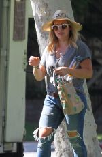 HILARY DUFF in Ripped Jeans at a Park in New York 07/25/2016
