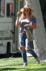 HILARY DUFF in Ripped Jeans at a Park in New York 07/25/2016