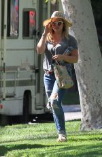HILARY DUFF in Ripped Jeans at a Park in New York 07/25/2016
