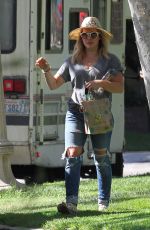 HILARY DUFF in Ripped Jeans at a Park in New York 07/25/2016