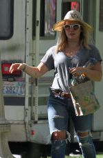 HILARY DUFF in Ripped Jeans at a Park in New York 07/25/2016
