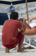 KENNEDY BARNES in Swimsuit on the Set of a Photoshoot at a Beach in Miami 07/20/2016