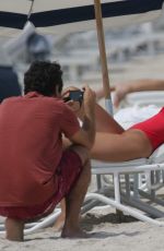 KENNEDY BARNES in Swimsuit on the Set of a Photoshoot at a Beach in Miami 07/20/2016