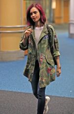 LILY COLLINS Arrives at Airport in Vancouver 07/28/2016.