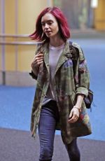 LILY COLLINS Arrives at Airport in Vancouver 07/28/2016.