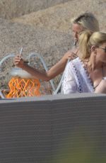 LINDSAY LOHAN ang HOFIT GOLAN on the Beach in Sardinia 07/30/2016