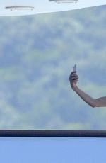 LINDSAY LOHAN in Bikini at a Yacht in Sardinia 07/27/2016