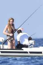 LINDSAY LOHAN in Swimsuit at a Boat in Sardinia 07/28/2016