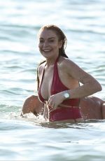 LINDSAY LOHAN in Swimsuit with Some Frinds at a Beach in Mykonos 07/04/2016