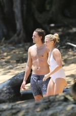 MARGOT ROBBIE in Swimsuit Surfing in Hawaii 07/19/2016
