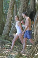 MARGOT ROBBIE in Swimsuit Surfing in Hawaii 07/19/2016