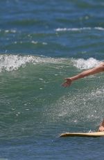MARGOT ROBBIE in Swimsuit Surfing in Hawaii 07/19/2016