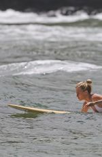 MARGOT ROBBIE in Swimsuit Surfing in Hawaii 07/19/2016