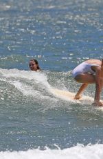 MARGOT ROBBIE in Swimsuit Surfing in Hawaii 07/19/2016