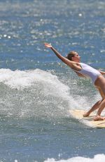 MARGOT ROBBIE in Swimsuit Surfing in Hawaii 07/19/2016