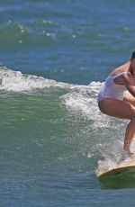 MARGOT ROBBIE in Swimsuit Surfing in Hawaii 07/19/2016