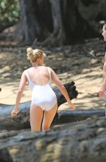 MARGOT ROBBIE in Swimsuit Surfing in Hawaii 07/19/2016