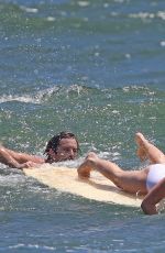 MARGOT ROBBIE in Swimsuit Surfing in Hawaii 07/19/2016